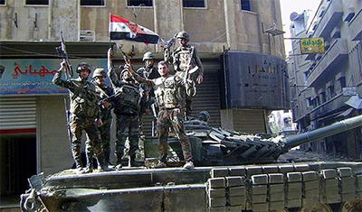 La bandera siria ondea en la ciudad recuperada